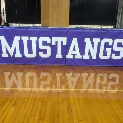 Mat covering stage at JRHS Gym